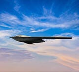 aircraft inflight against cloudy blue sky
