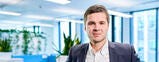 Polish Man looking at camera in office. 
