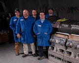Group of men in blue jump suits