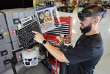 person pointing at digital tool