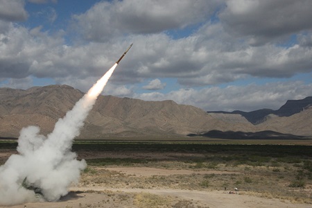 Rocket launch on cloudy day