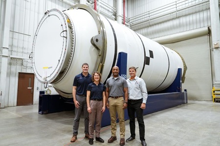 Northrop Grumman’s twin solid rocket booster segments with Artemis II astronauts (from left to right: Jeremy Hansen, Christina Koch, Victor Glover and Reid Wiseman). (Photo Credit: Northrop Grumman) Northrop Grumman Delivers Rocket Booster Segments for NASA's Artemis II Mission