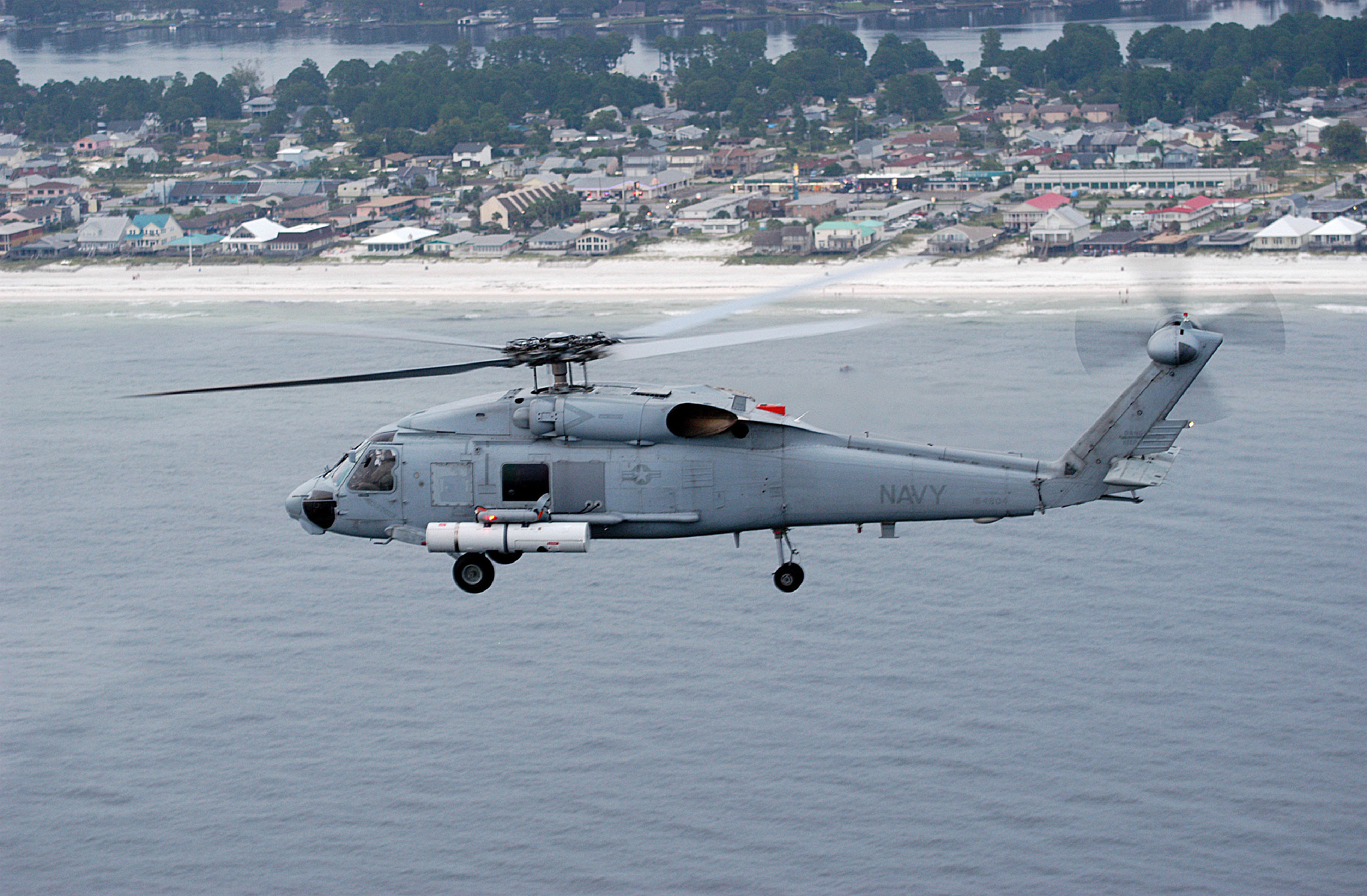 Helicopter in flight with ALMDS pod