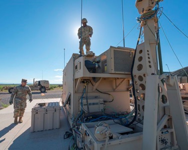 soldiers setting up military equipment.