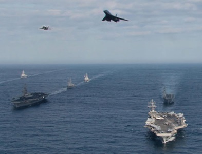 Navy ships sailing in formation.