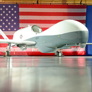 triton in front of the american flag