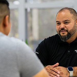 two people talking at a table