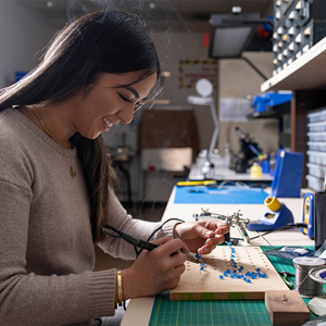 woman working on project at desk