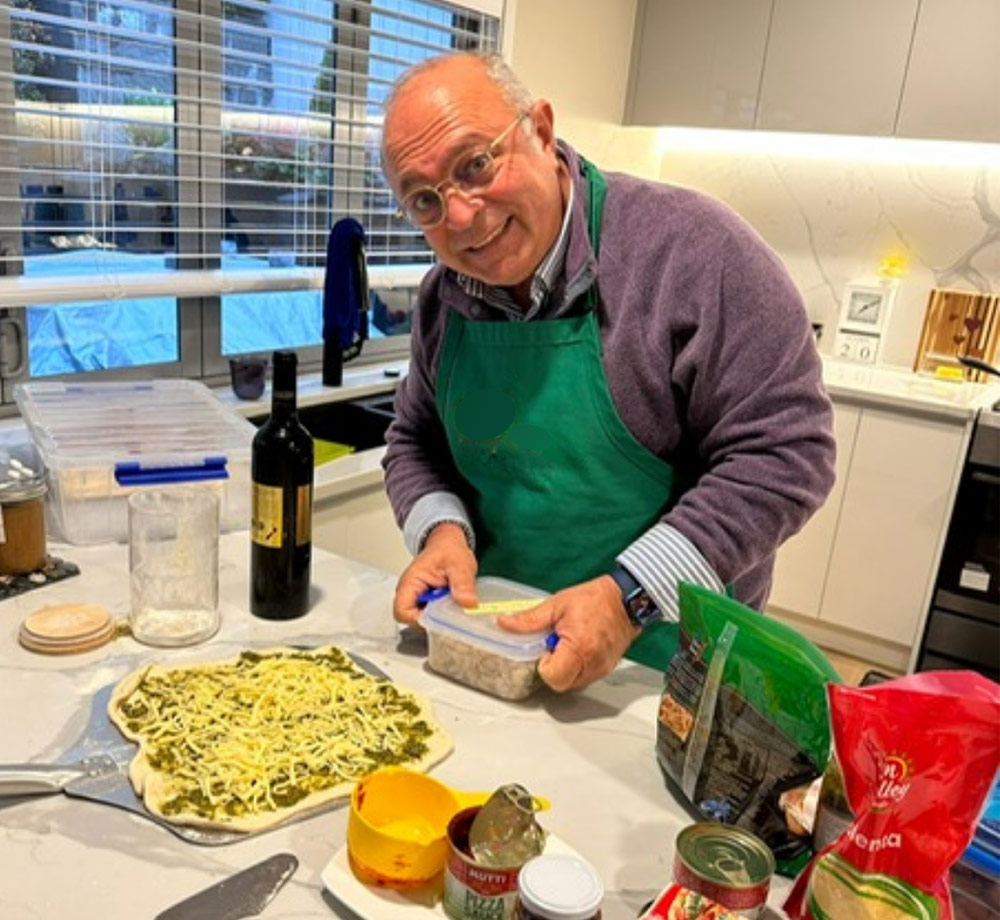 man in kitchen preparing meal