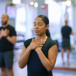 woman in yoga pose in a group class