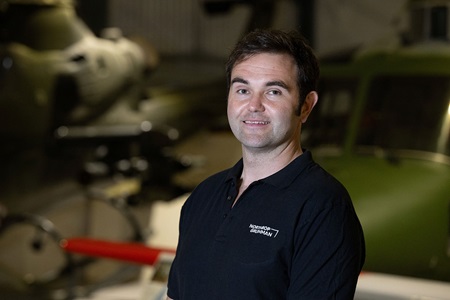 man in black shirt smiling