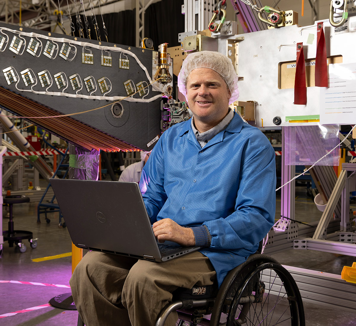 headshot of man in wheelchair with laptop