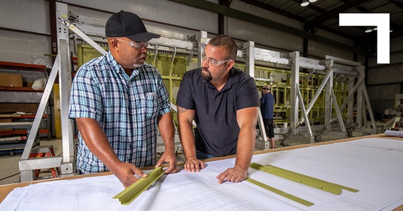 two men at drafting table