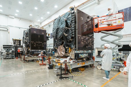 Satellite being serviced in highbay