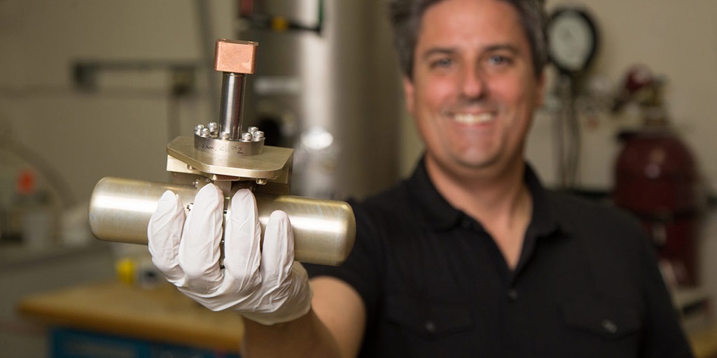 man holding cryocooler