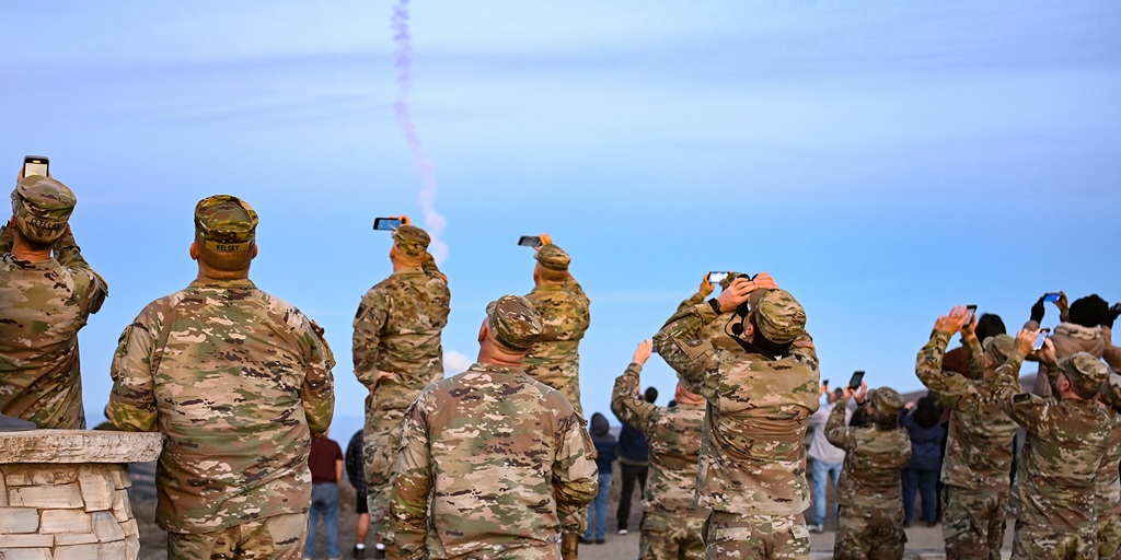 military personnel watching a missile test