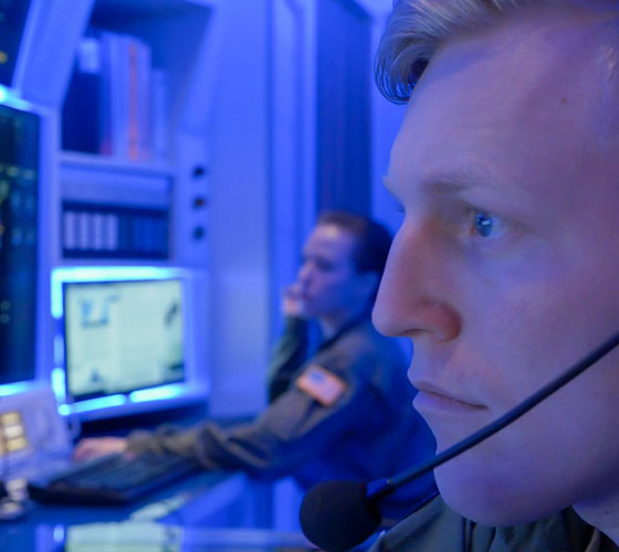 Air Force Personnel looking at computers