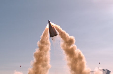 Defense weapon system with plumes of smoke in air. 