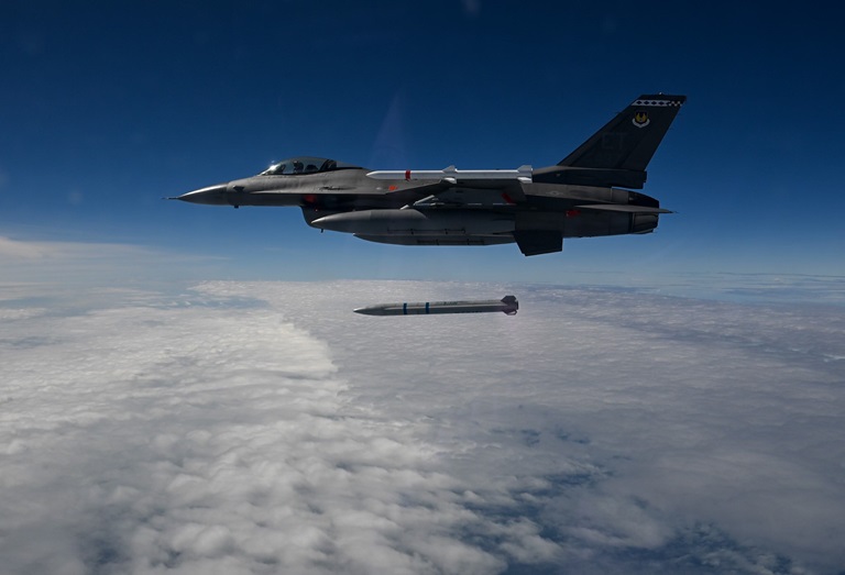 Missile dropping from fighter jet