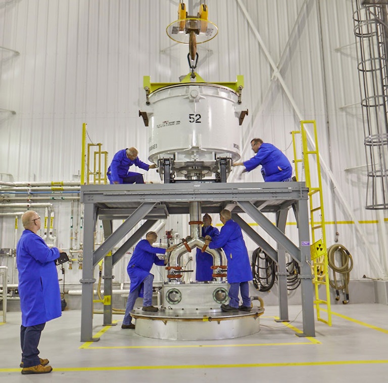 Workers in blue lab suits testing hypersonic missile