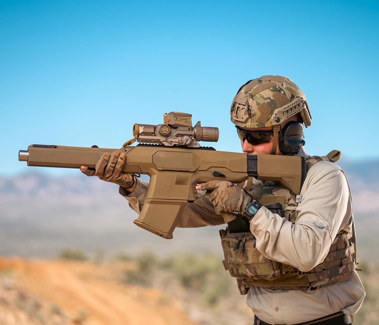 soldier holding Precision Grenadier System weapon
