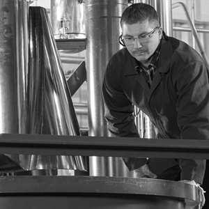 man working on solid rocket motor