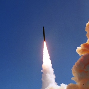 Minuteman missile launch into blue skies