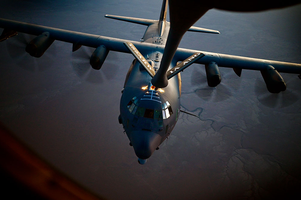 military aircraft being refueled in air