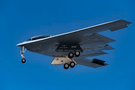 B-2 Spirit stealth bomber flying in blue skies