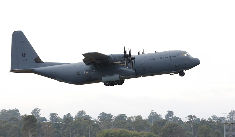 c-130 military transport aircraft taking off