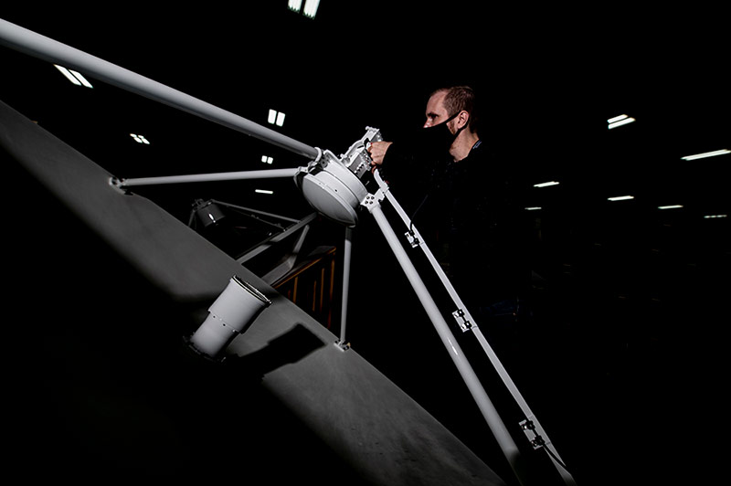 man preforming maintenance on ground radar