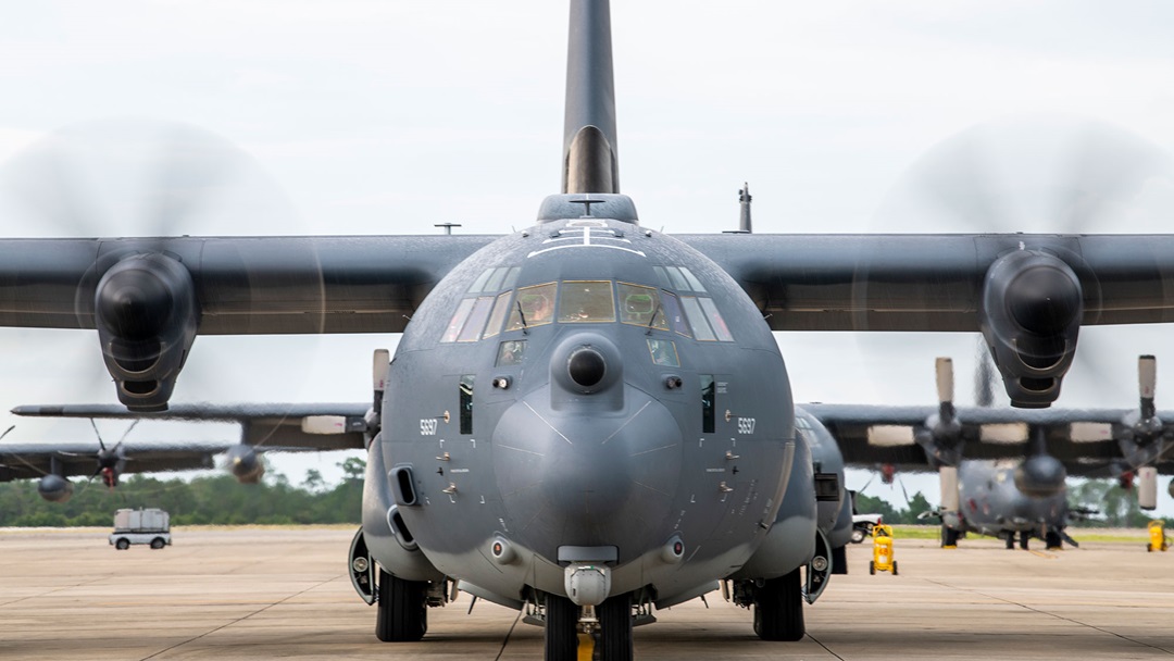 military plane prepares for flight on runway