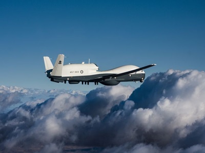 Australian MQ-4C Triton flying above clouds