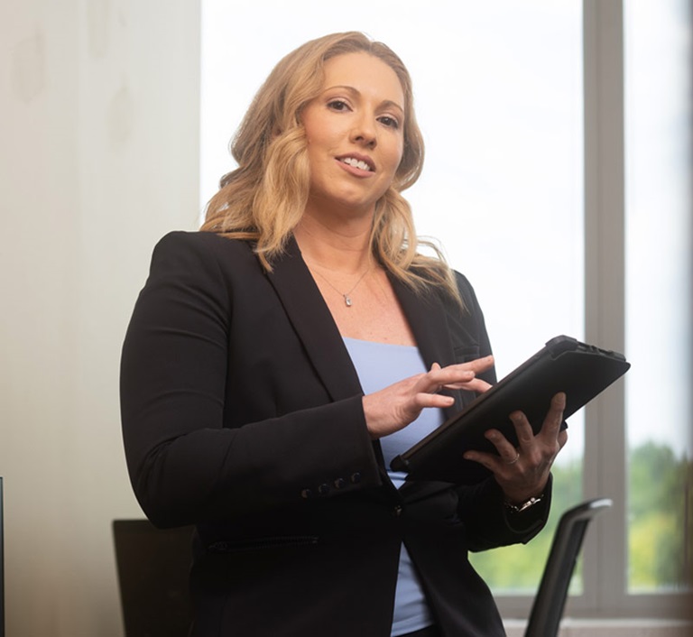 Multifunction Sensors – Join Our Team woman wearing business suit holding tablet