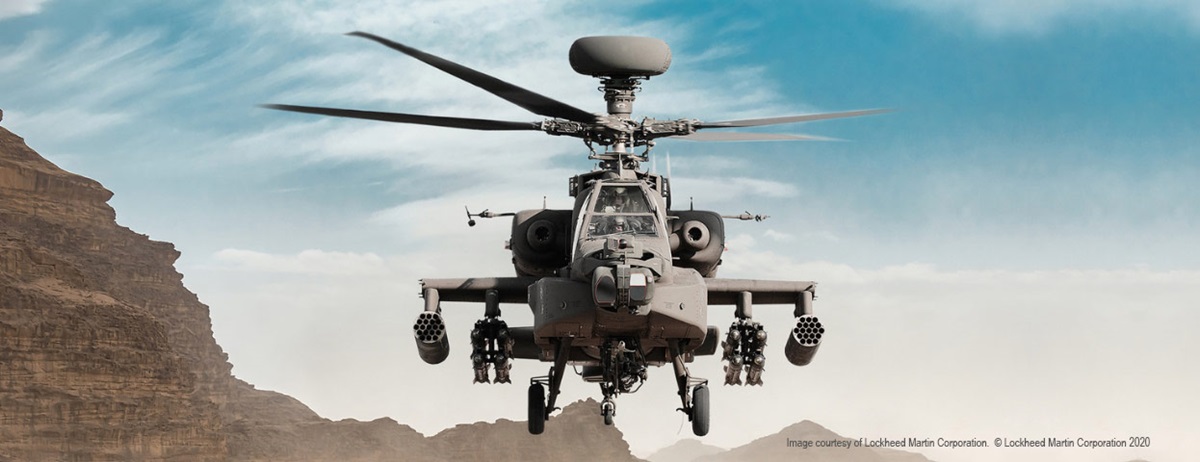 blackhawk helicopter flying over mountains