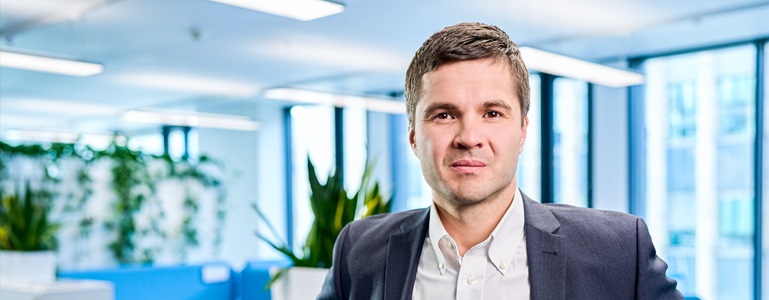 Polish Man looking at camera in office. 