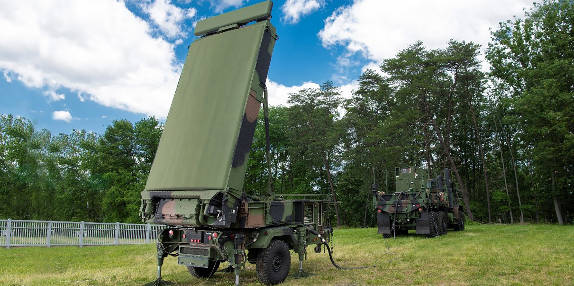 Three-dimensional, multi-mode, gallium nitride land radar displayed on grass