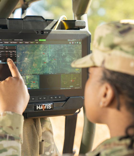 military person pointing to digital screen