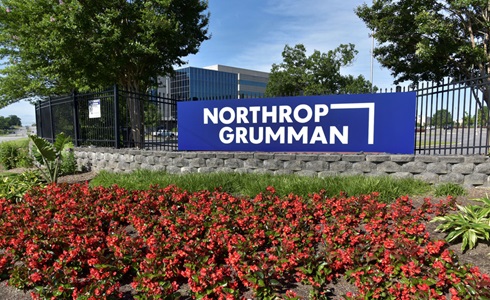 photo of building with flowers under northrop grumman sign