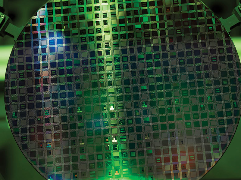 Microelectronics – microchip processor wafer green wafer