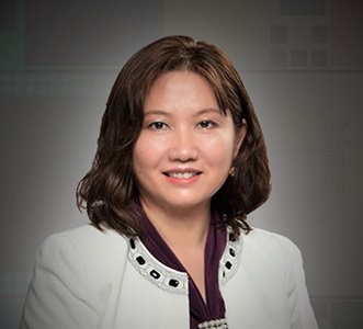 The Process for Precision Professional portrait of a female engineer in a white jacket, representing innovation and leadership in microelectronics at Northrop Grumman.
