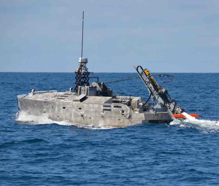 Northrop Grumman Successfully Completes Initial In-Water Testing of the AQS-24 Mine Hunting Sonar Using a Next Generation Deploy and Retrieval Payload AQS-24B minehunting system launched from an unmanned surface vehicle, operating in open water with crew and equipment visible.
