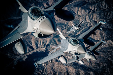 F-16's jet flying over mountains