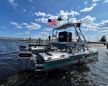 uncrewed surface vehicle on platform of boat in water