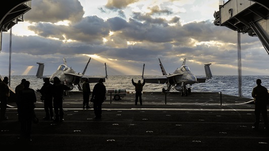 Image at dusk of F-18 USS Roosevelt from inside the carrier