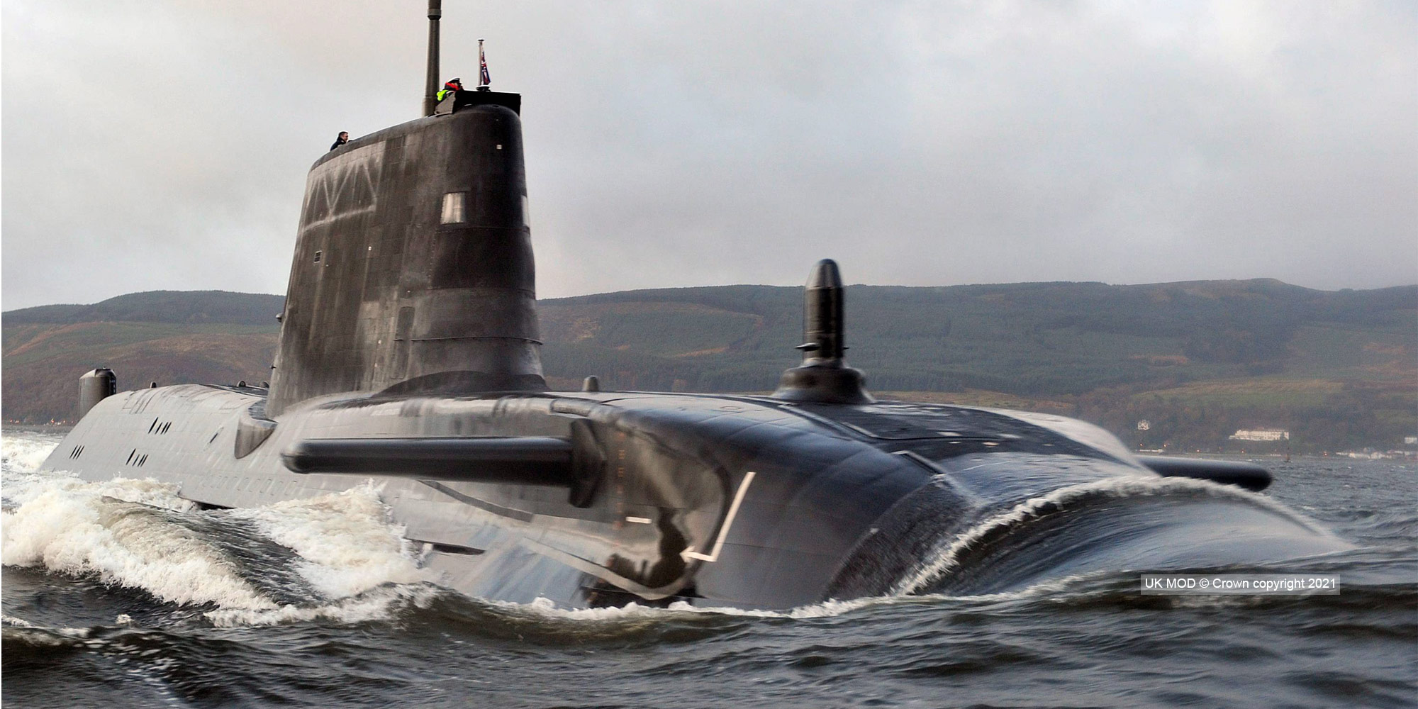 submarine partially submerged in sea 