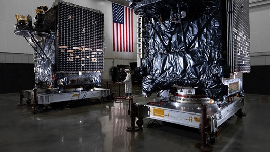 Arctic Broadband Satellite Mission manufacturing in lab with technician.
