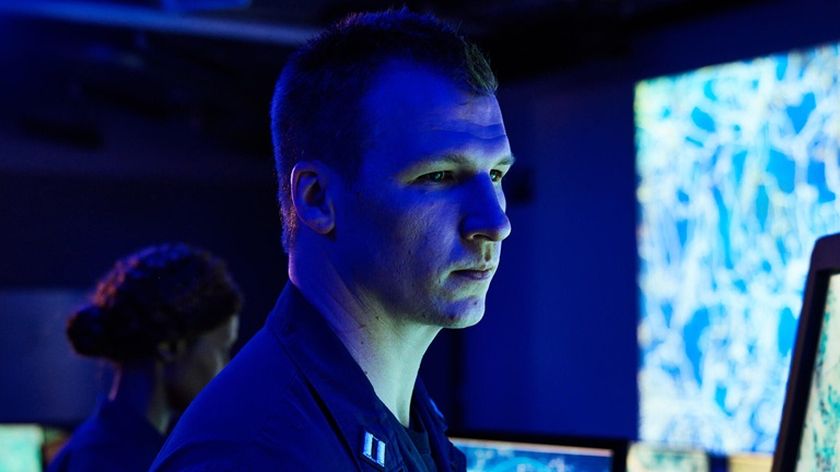 man sitting at computer