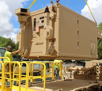 Man unloads military equipment. 