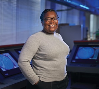 Woman smiling in computer lab